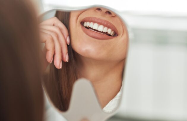 Medi Transformation Smiling Checking Out Her Perfect Healthy Teeth Mirror Close Up Dentist Office