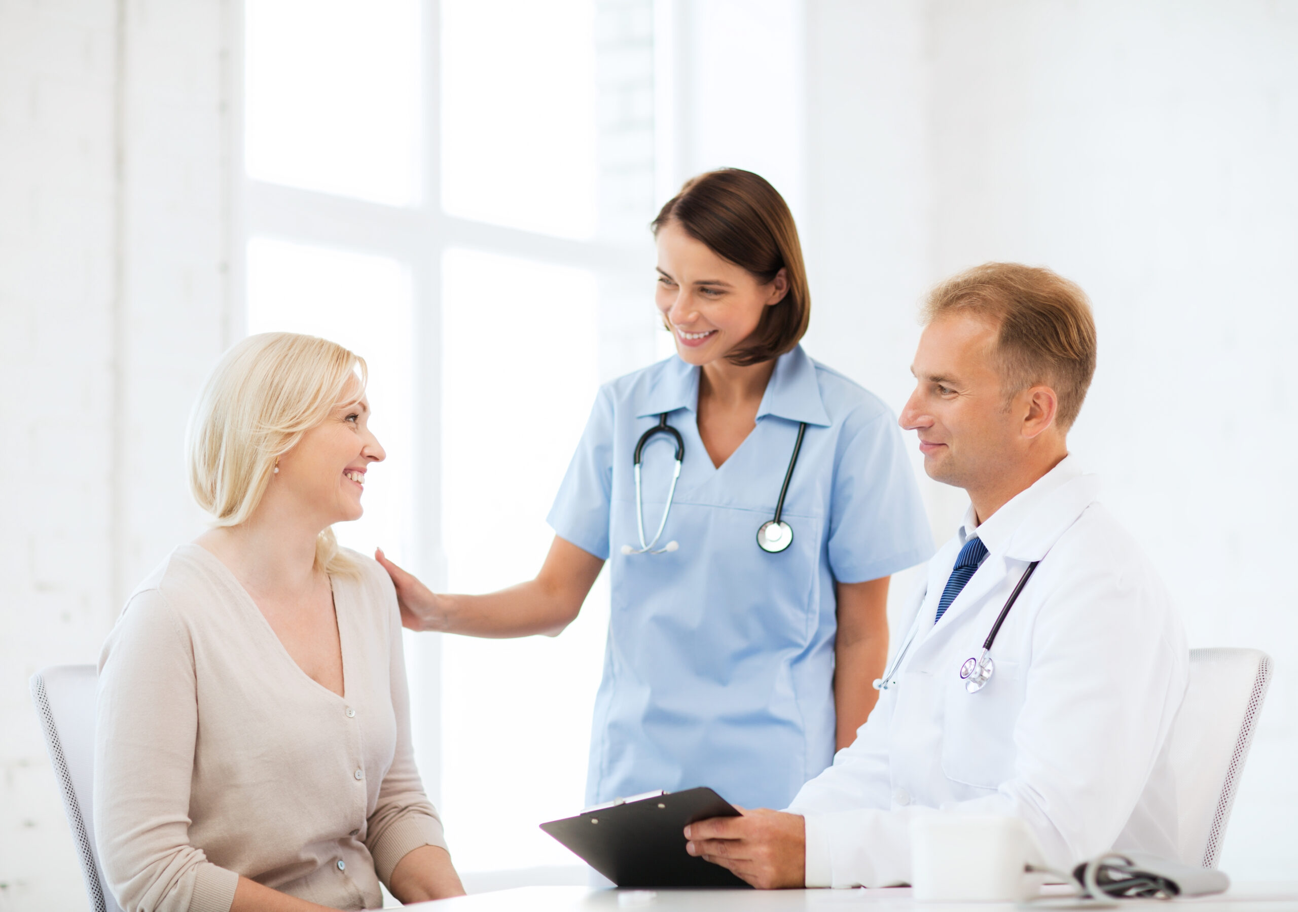 Doctor With Patient In Hospital